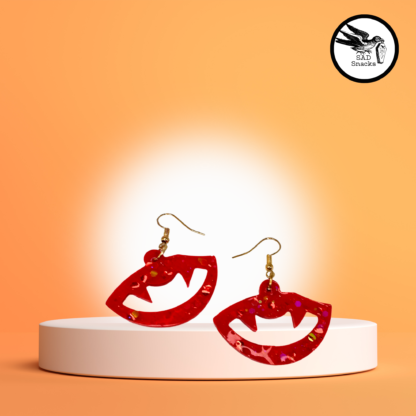 red sparkle fang earrings