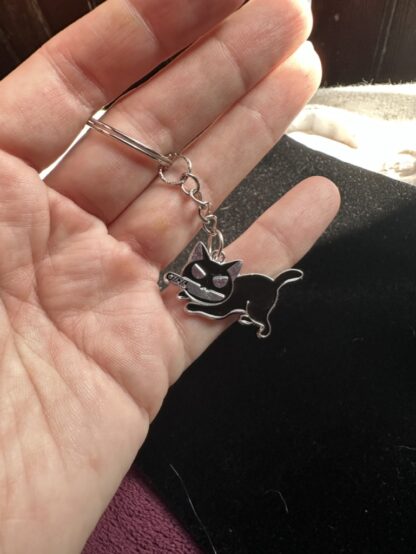 Knife attack kitty keychain