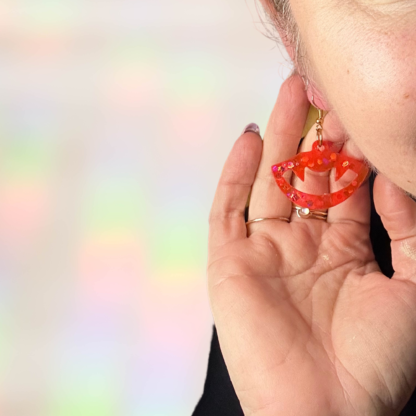 red sparkle resin vampire fang earrings